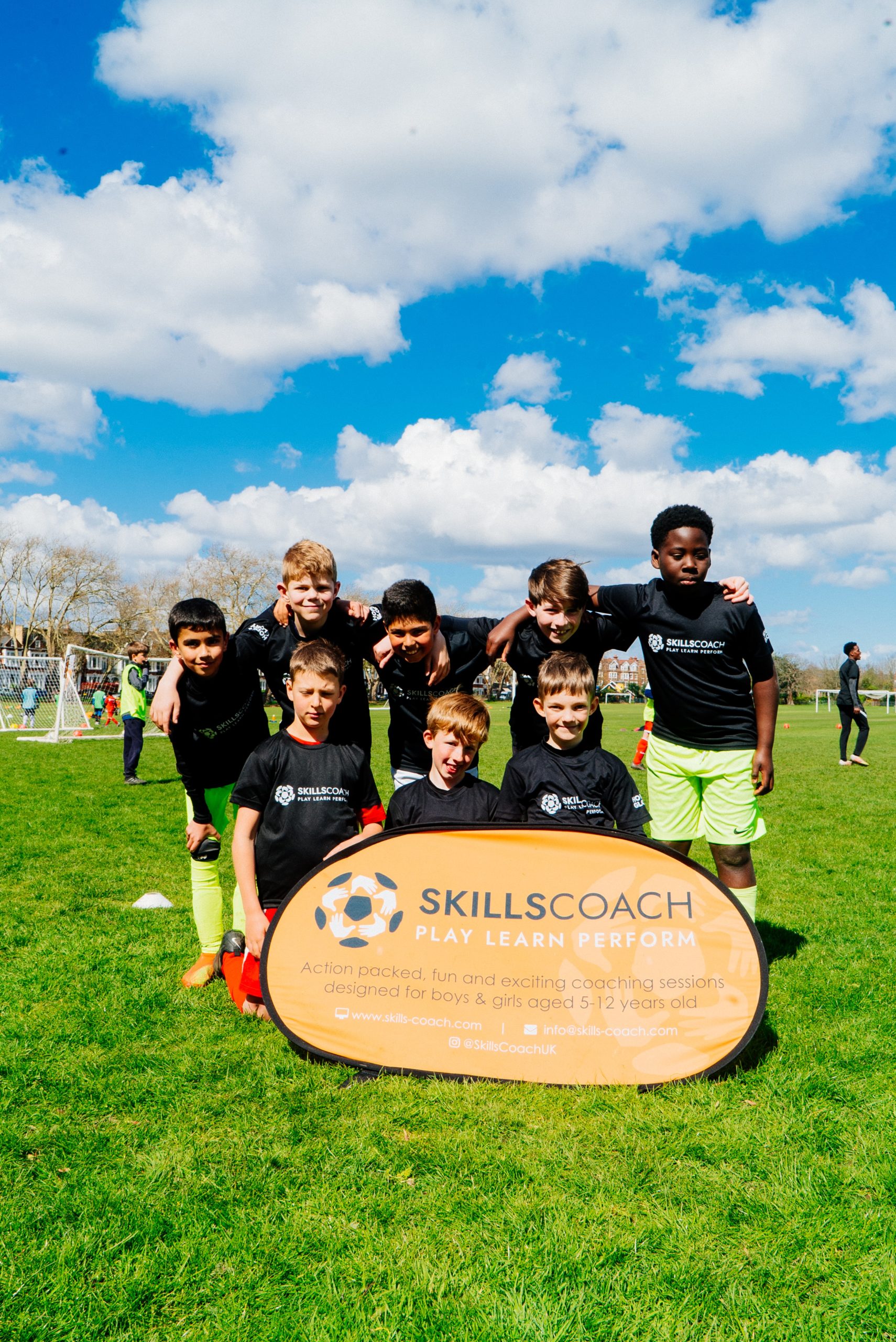 Boys standing in football kits